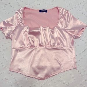 Selling a silky pink shirt, for a casual look.